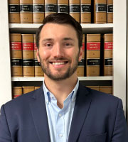 Michael E. Howard in front of law books
